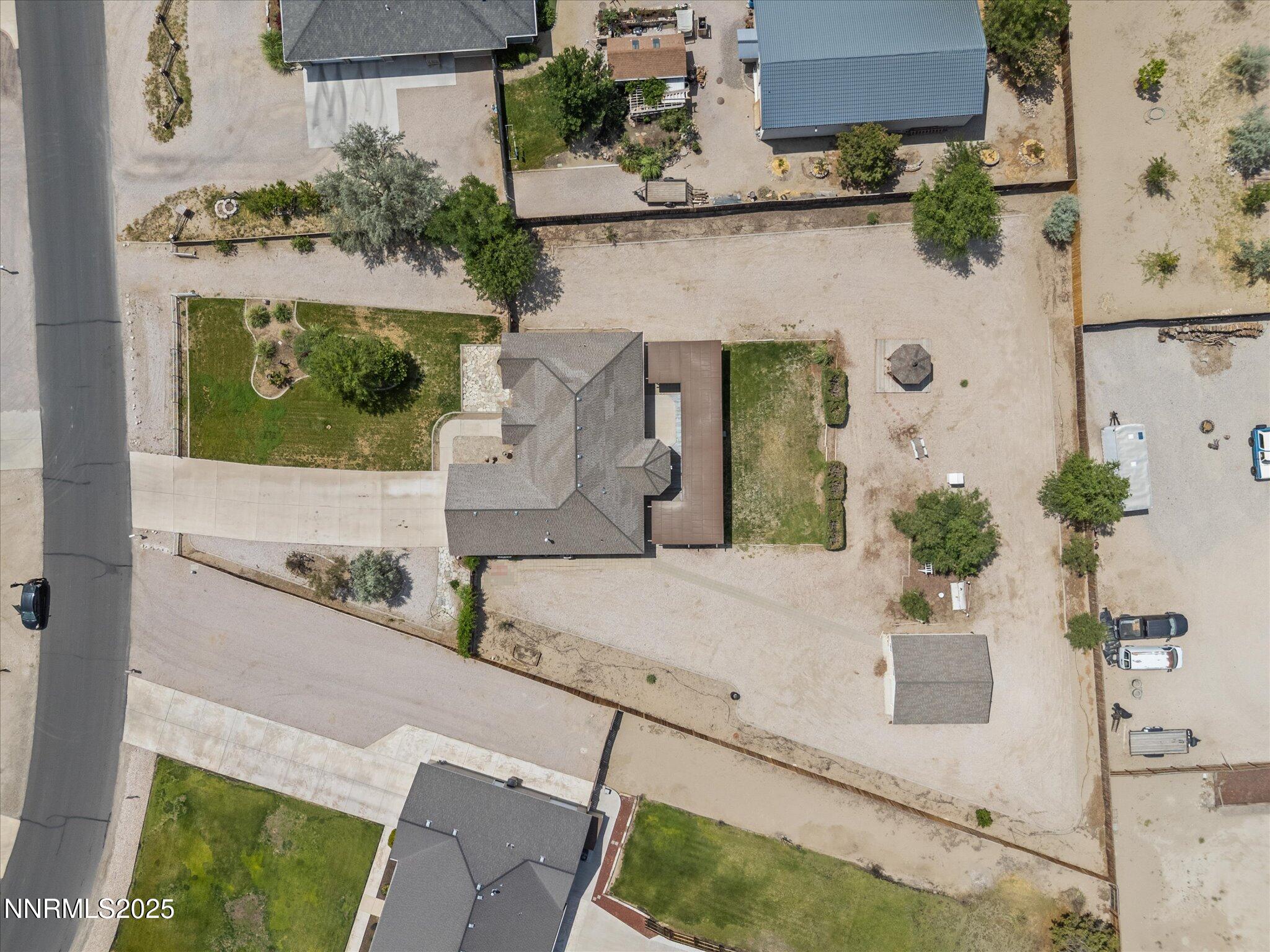 696 Sunrise Terrace Fallon, NV 89406 - Photo 60 of 65 an aerial view of a house with a yard and a garage