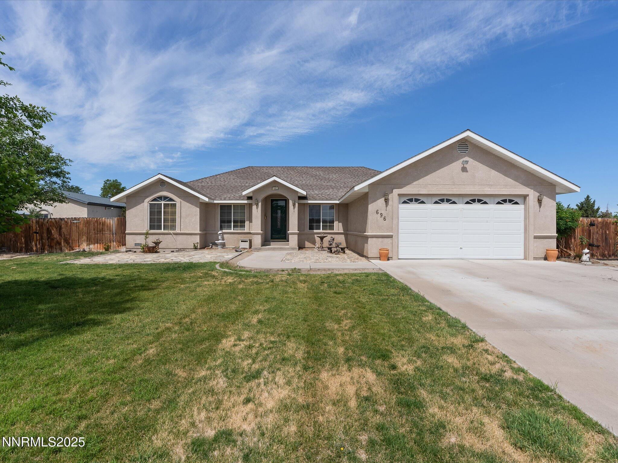 696 Sunrise Terrace Fallon, NV 89406 - Photo 6 of 65 a front view of a house with garden