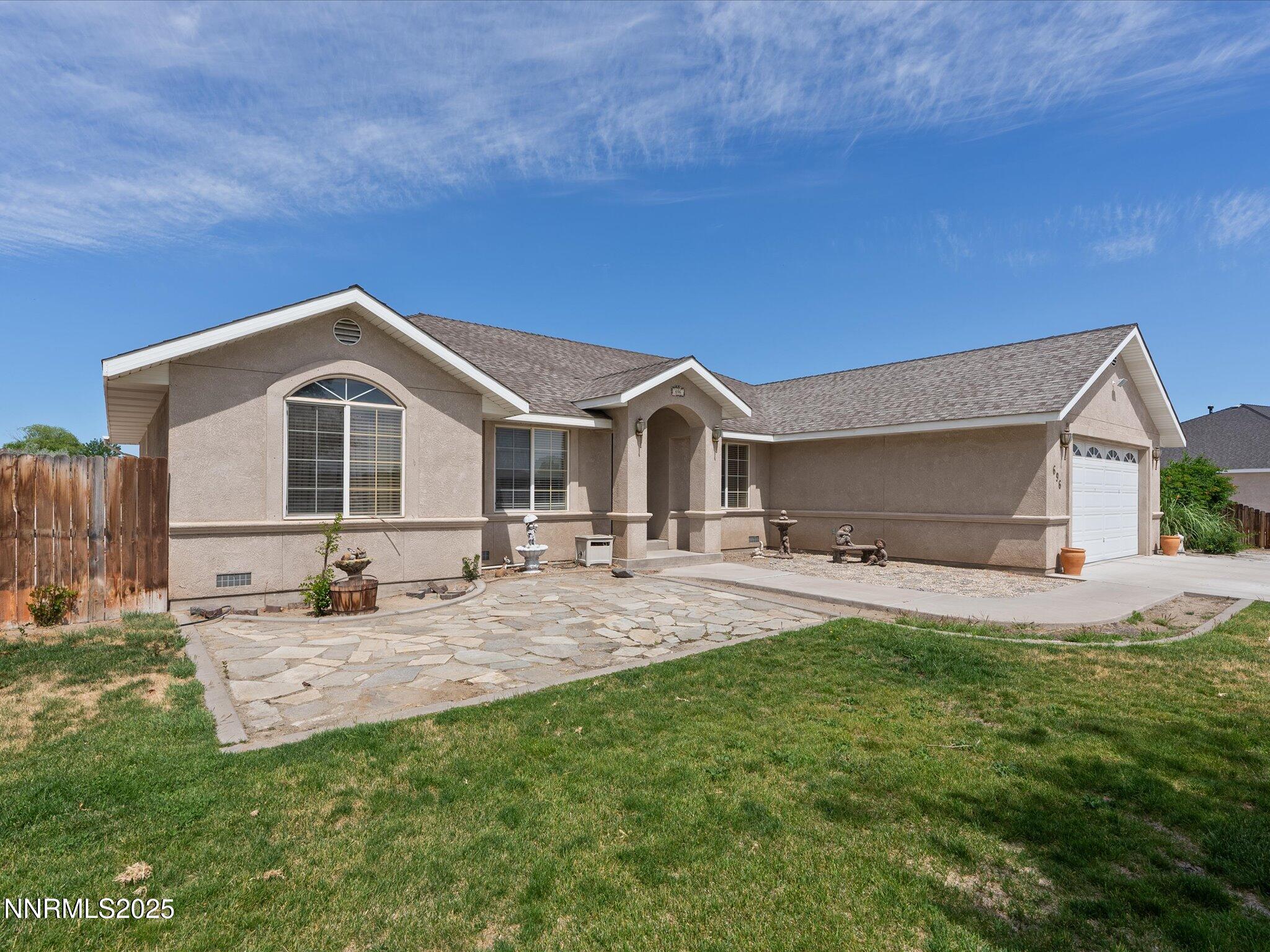 696 Sunrise Terrace Fallon, NV 89406 - Photo 7 of 65 a front view of a house with patio and yard