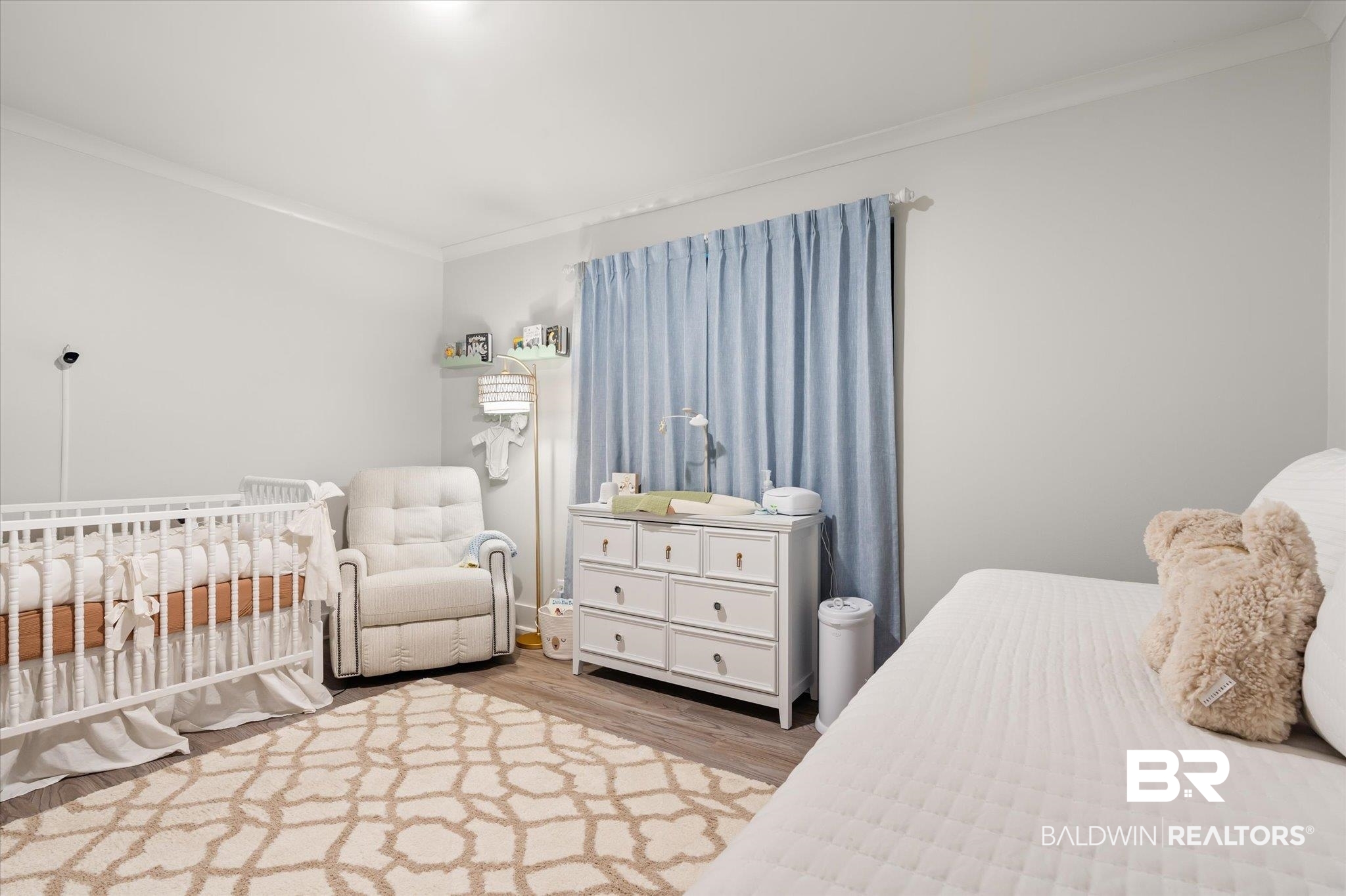 3655 Old Shell Road, Unit 313 Mobile, AL 36608 - Photo 19 of 20 Bedroom featuring light hardwood / wood-style floors, crown molding, and a nursery area