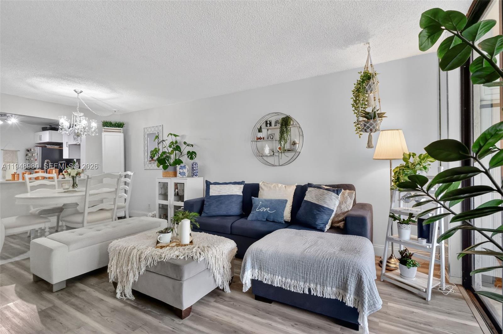8150 West McNab Road, Unit 304 Tamarac, FL 33321 - Photo 14 of 33 a living room with furniture and a potted plant