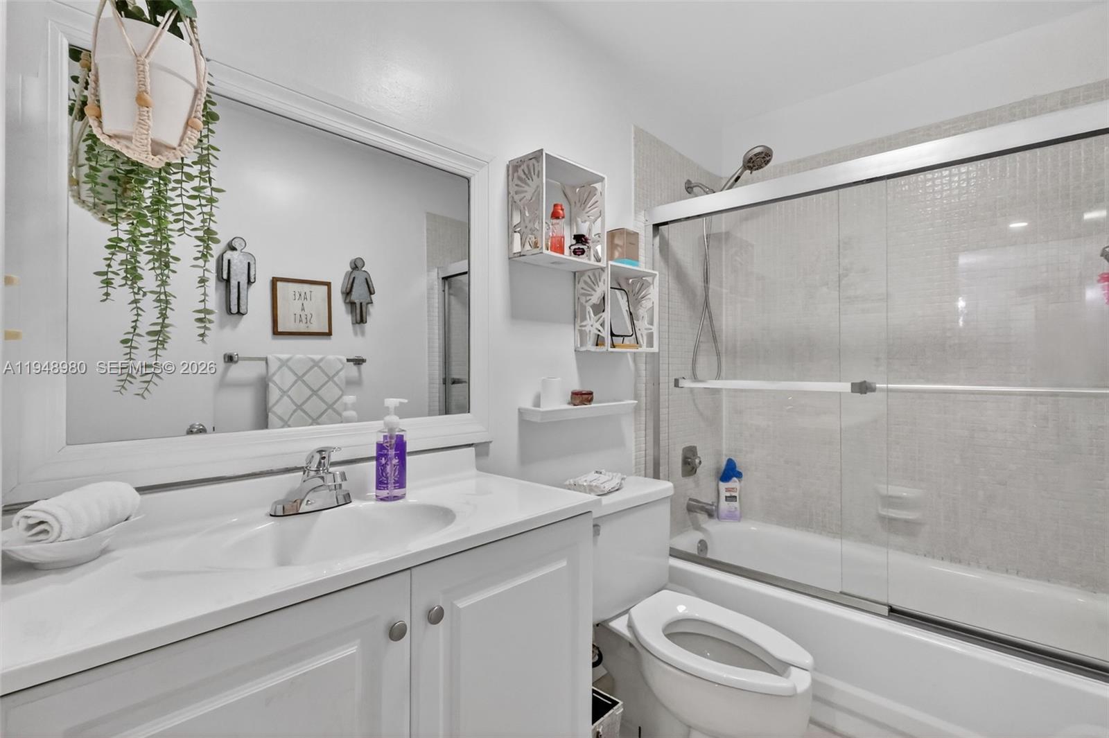 8150 West McNab Road, Unit 304 Tamarac, FL 33321 - Photo 18 of 33 a bathroom with a sink a toilet and shower