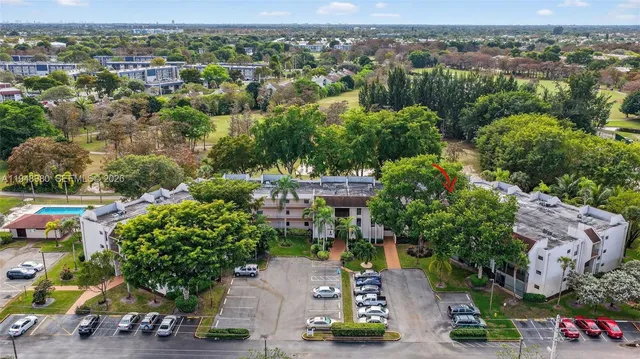 an aerial view of a house with yard