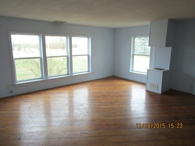17333 East Lind Road Rochelle, IL 61068 - Photo 14 of 25 a view of empty room with window and wooden floor
