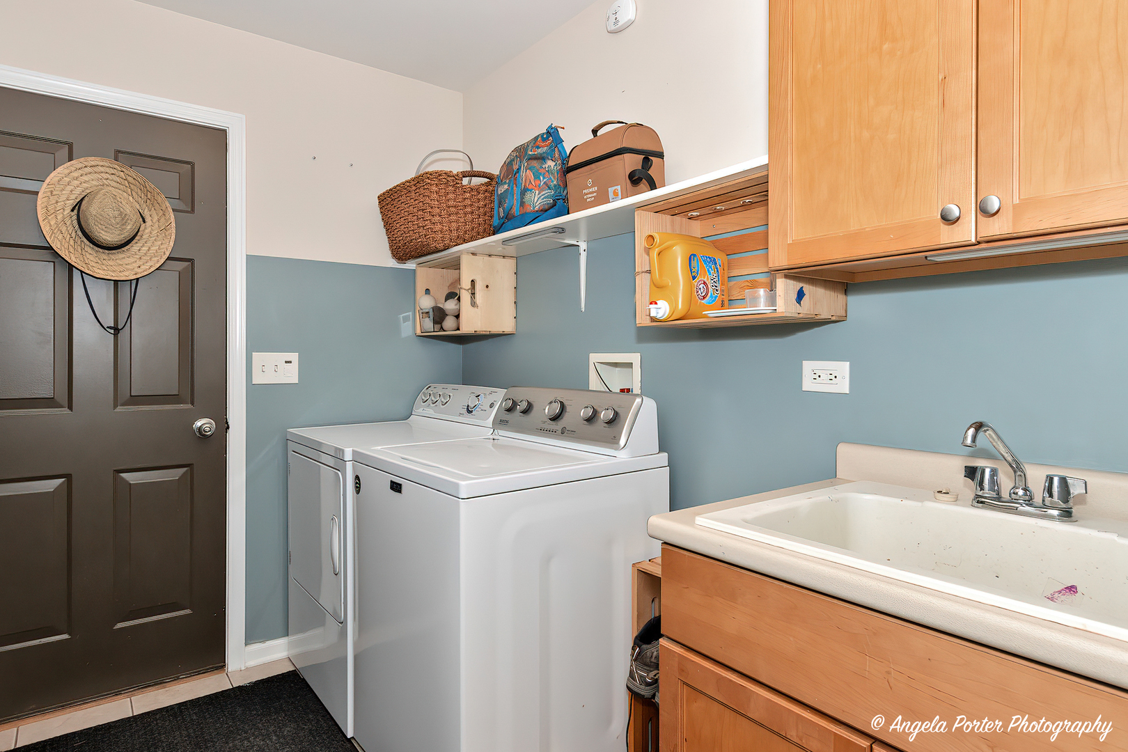 6715 Normandy Drive Spring Grove, IL 60081 - Photo 14 of 31 a bathroom with a sink and a washer dryer