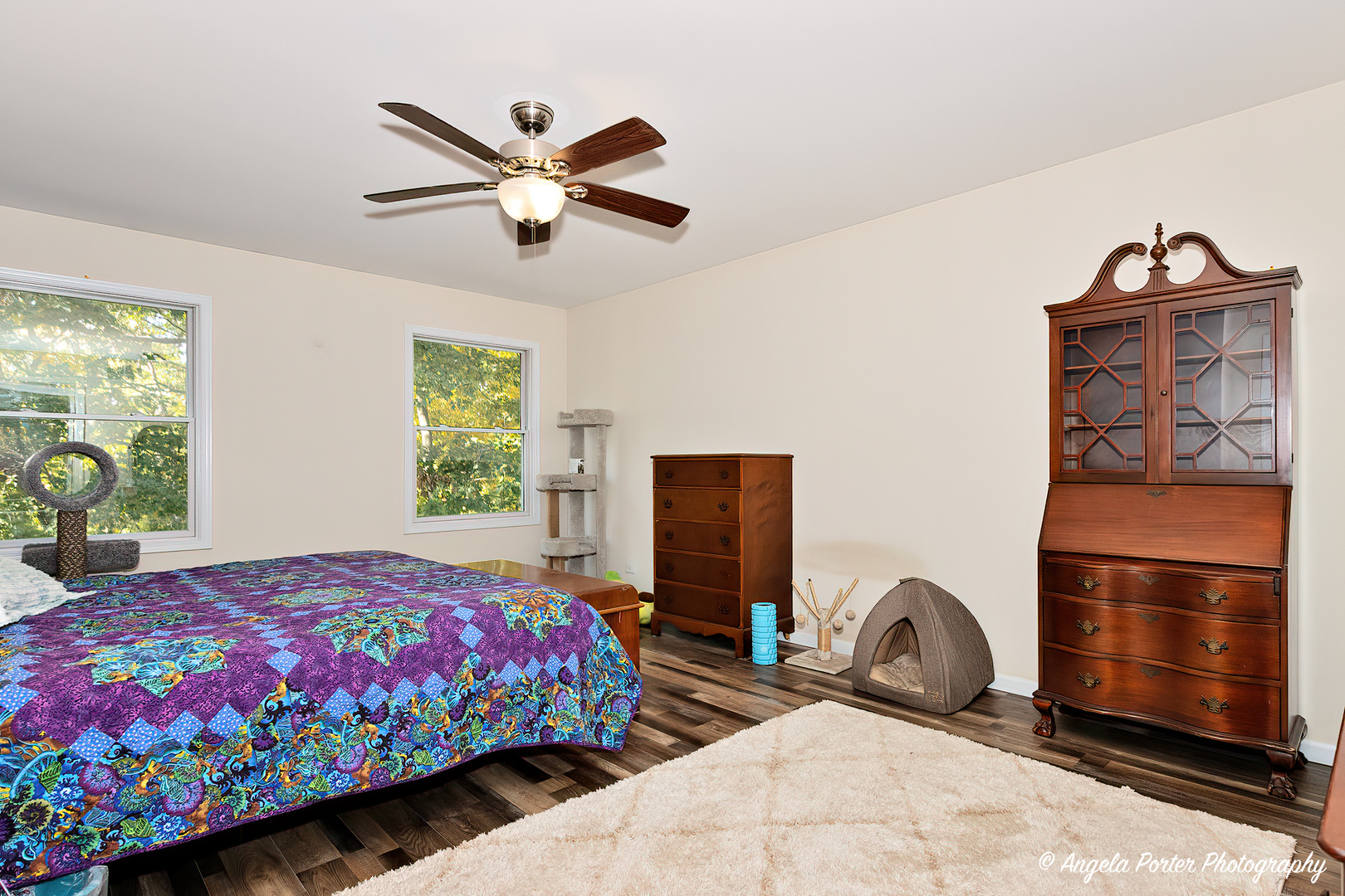 6715 Normandy Drive Spring Grove, IL 60081 - Photo 15 of 31 a bedroom with a bed dresser and a window