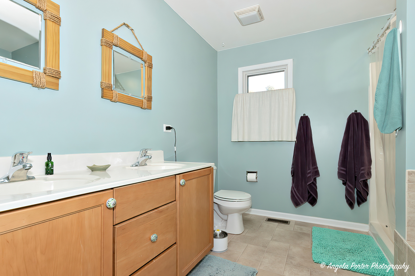6715 Normandy Drive Spring Grove, IL 60081 - Photo 18 of 31 a bathroom with a toilet sink and mirror