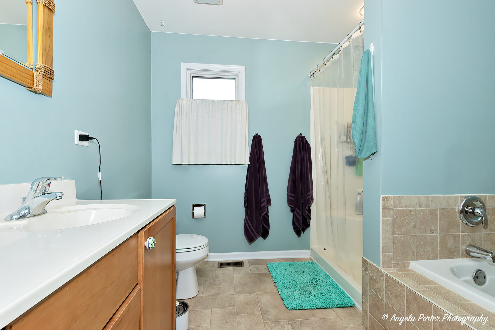 6715 Normandy Drive Spring Grove, IL 60081 - Photo 19 of 31 a bathroom with a sink a toilet and shower