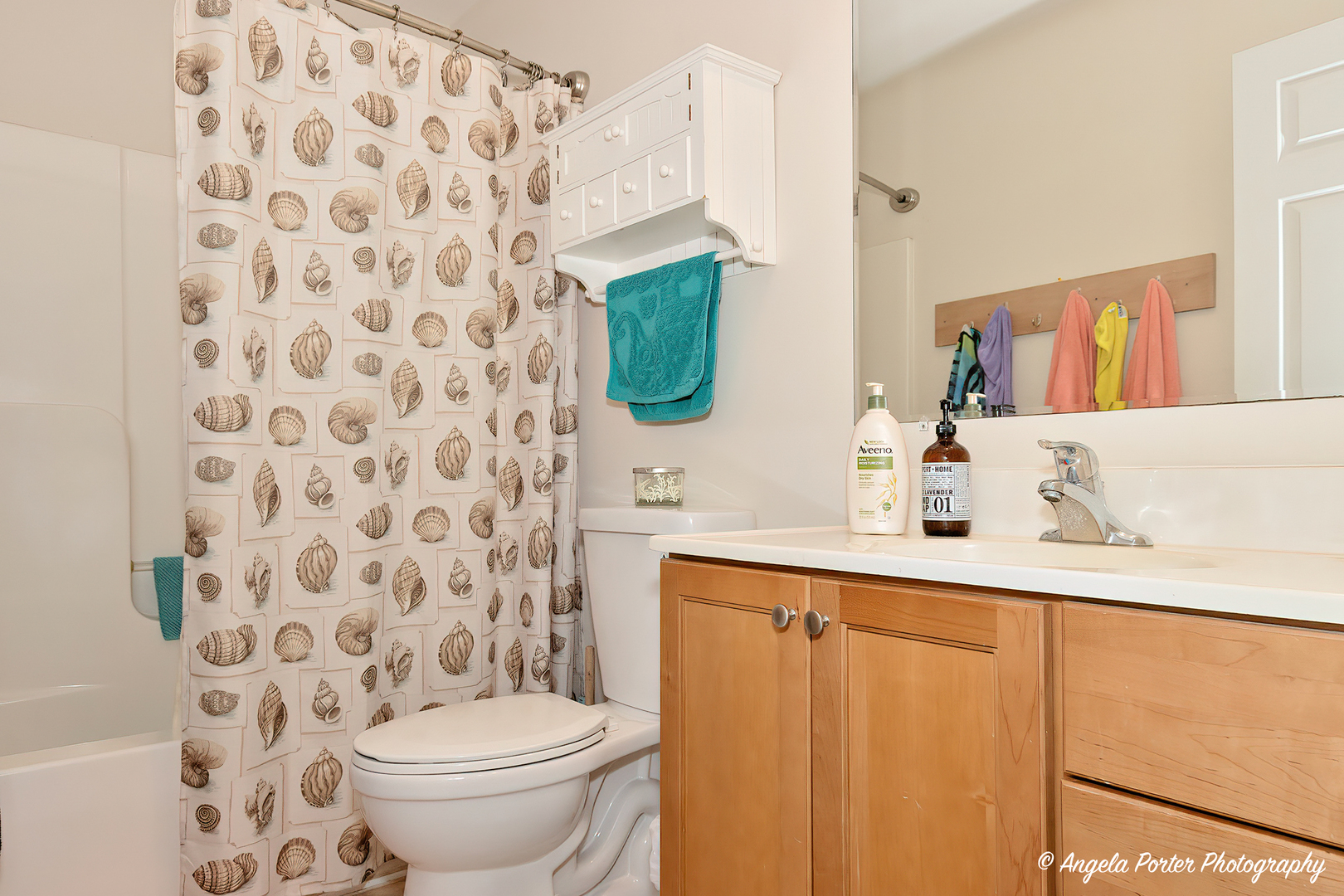 6715 Normandy Drive Spring Grove, IL 60081 - Photo 24 of 31 a bathroom with a sink toilet and mirror