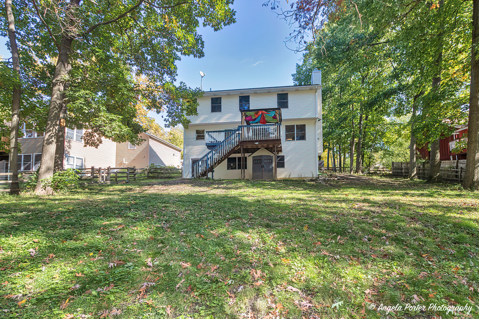 6715 Normandy Drive Spring Grove, IL 60081 - Photo 27 of 31 a front view of a house with a yard