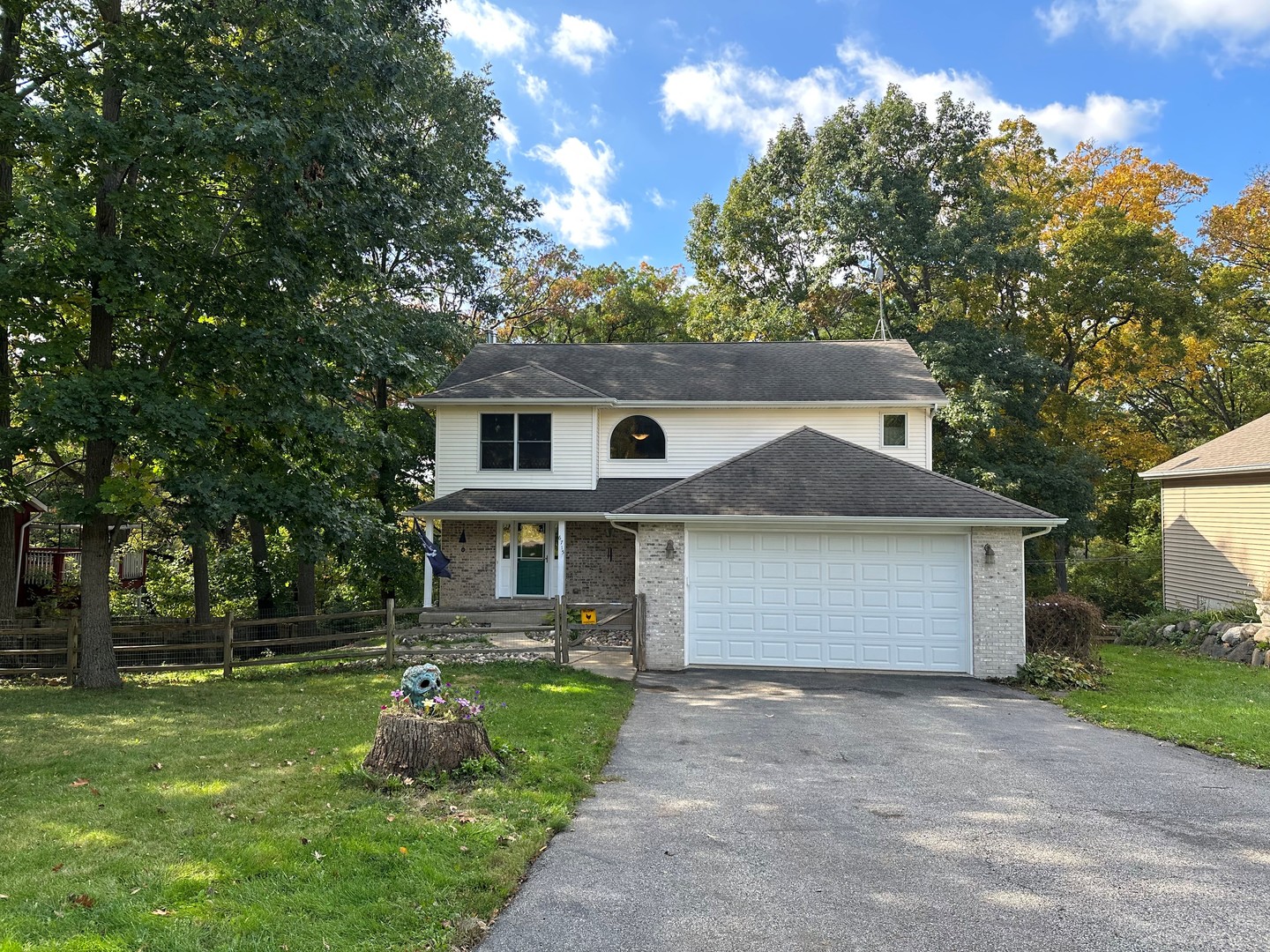 6715 Normandy Drive Spring Grove, IL 60081 - Photo 30 of 31 a front view of house with a garden