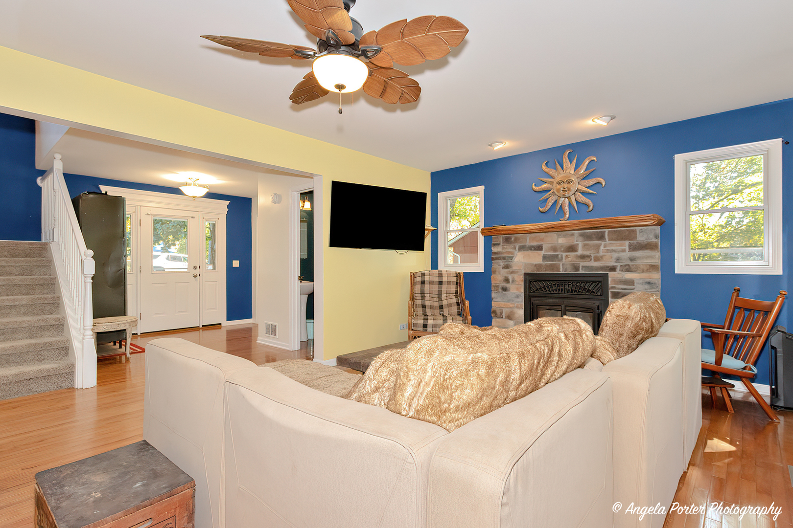 6715 Normandy Drive Spring Grove, IL 60081 - Photo 4 of 31 a living room with furniture a fireplace and a flat screen tv