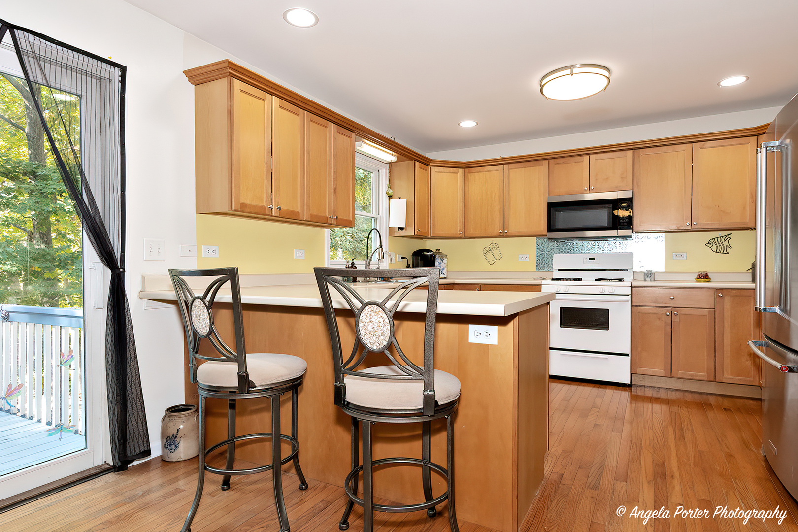 6715 Normandy Drive Spring Grove, IL 60081 - Photo 8 of 31 a kitchen with stainless steel appliances a stove a sink dishwasher and a refrigerator
