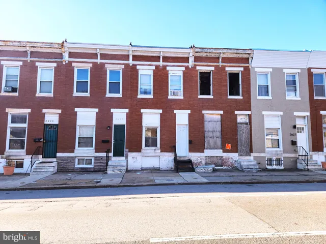 a front view of a building with street view