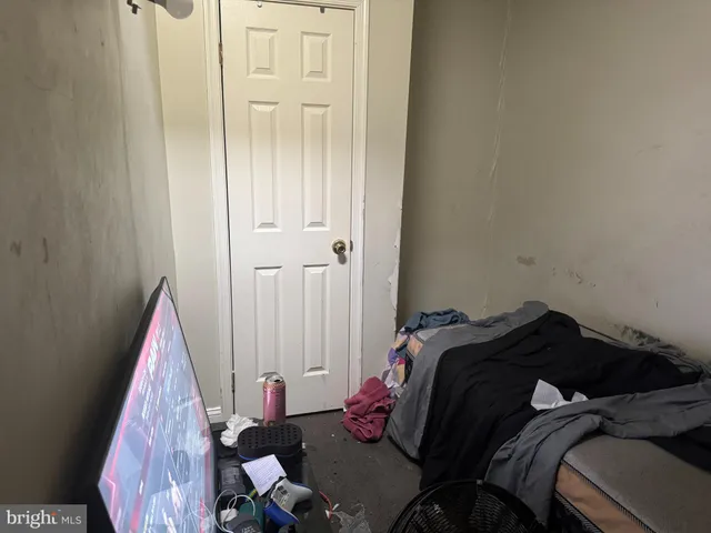 a bedroom with a bed and a mirror