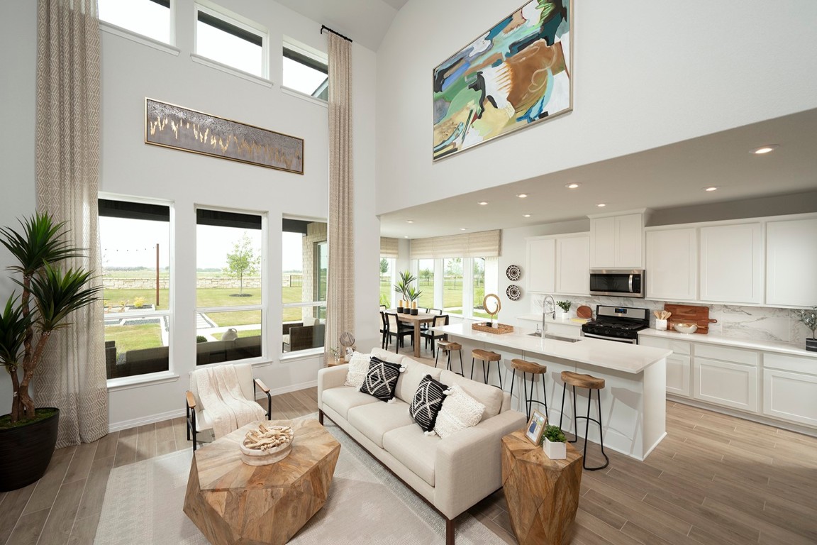 420 Ridgewell Loop Georgetown, TX 78633 - Photo 24 of 25 a living room with furniture and a large window