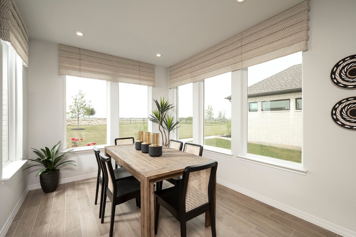 420 Ridgewell Loop Georgetown, TX 78633 - Photo 13 of 25 a view of a dining room with furniture window and wooden floor
