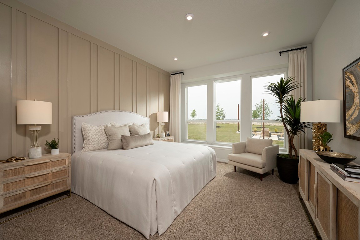 420 Ridgewell Loop Georgetown, TX 78633 - Photo 14 of 25 a bedroom with bed and a large window