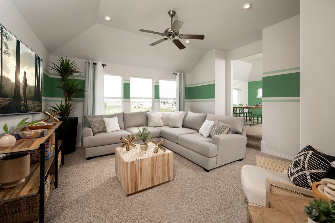 420 Ridgewell Loop Georgetown, TX 78633 - Photo 16 of 25 a living room with furniture a ceiling fan and a window