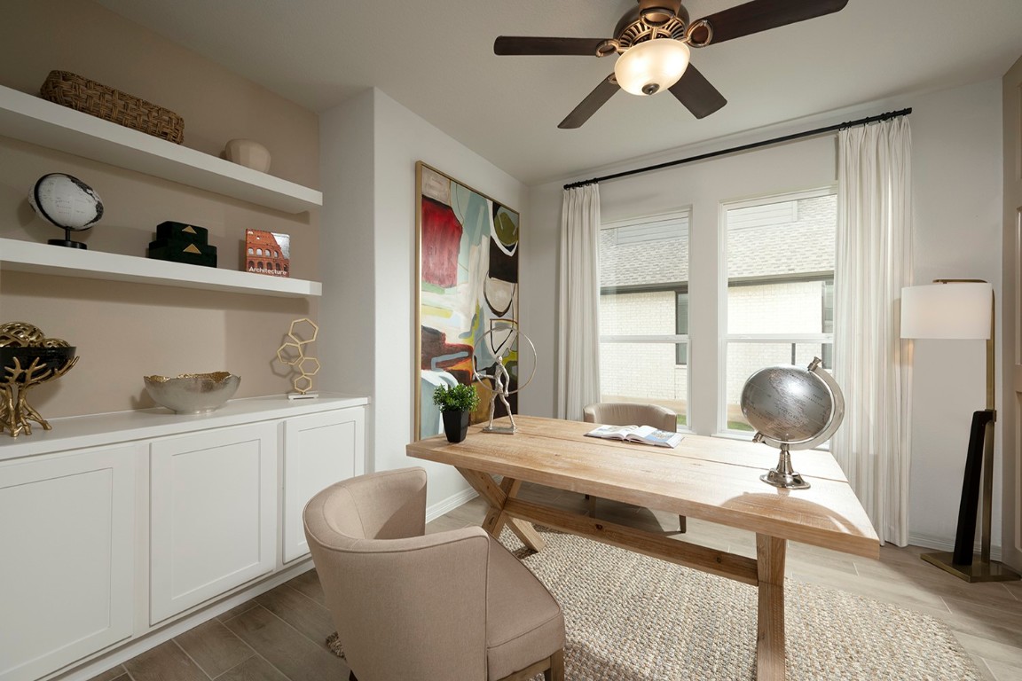420 Ridgewell Loop Georgetown, TX 78633 - Photo 18 of 25 a living room with furniture and a window