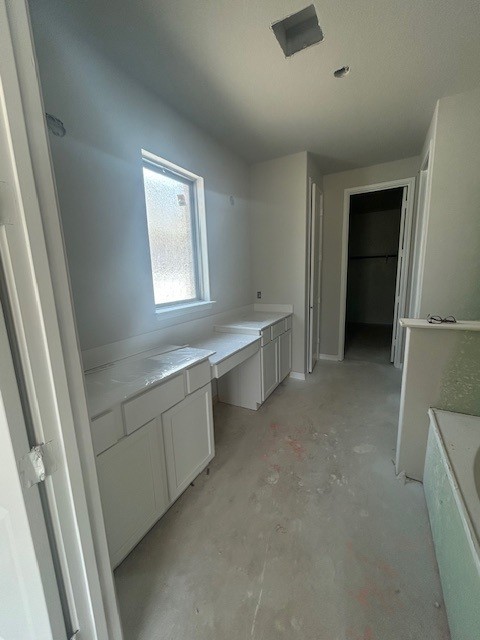420 Ridgewell Loop Georgetown, TX 78633 - Photo 6 of 25 a view of an empty room with window and cabinet
