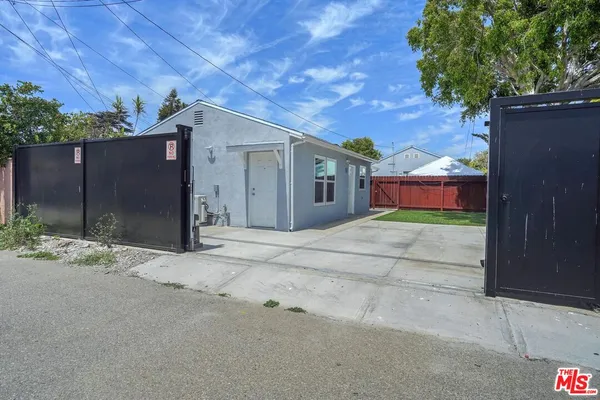 front view of a house with a yard and a garage