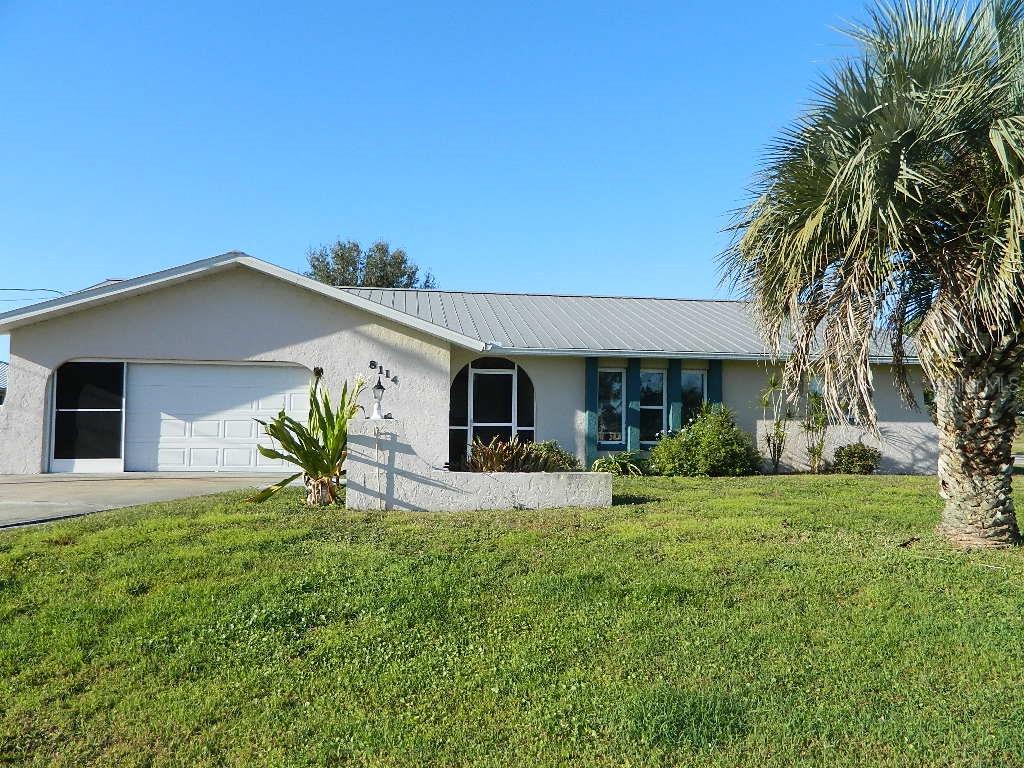 8114 Southwest Sunnybreeze Road Arcadia, FL 34269 - Photo 1 of 1 a front view of house with yard and outdoor seating
