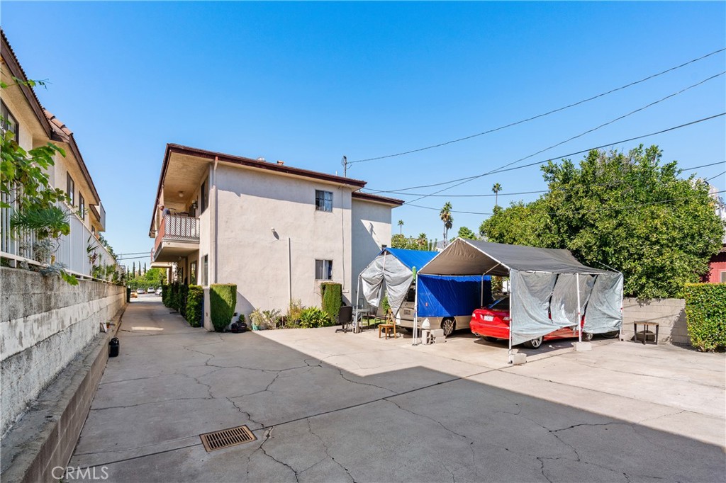 1116 Rosedale Avenue Glendale, CA 91201 - Photo 7 of 8 a view of a patio with couches and table and chairs under an umbrella