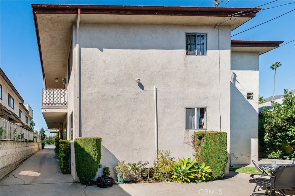 1116 Rosedale Avenue Glendale, CA 91201 - Photo 8 of 8 a view of a house with a potted plant and floor to ceiling window