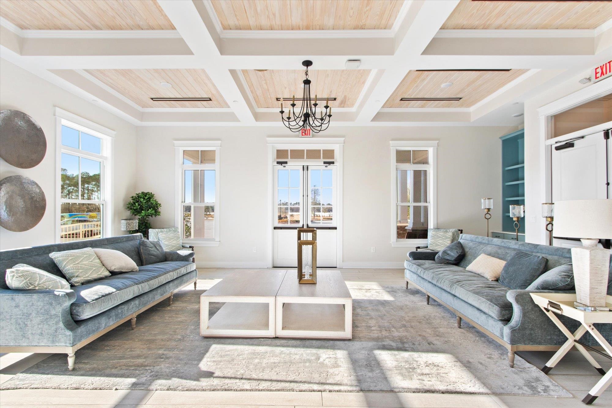 41 Cinnamon Teal Way St. Augustine, FL 32092 - Photo 56 of 60 a living room with furniture and a chandelier