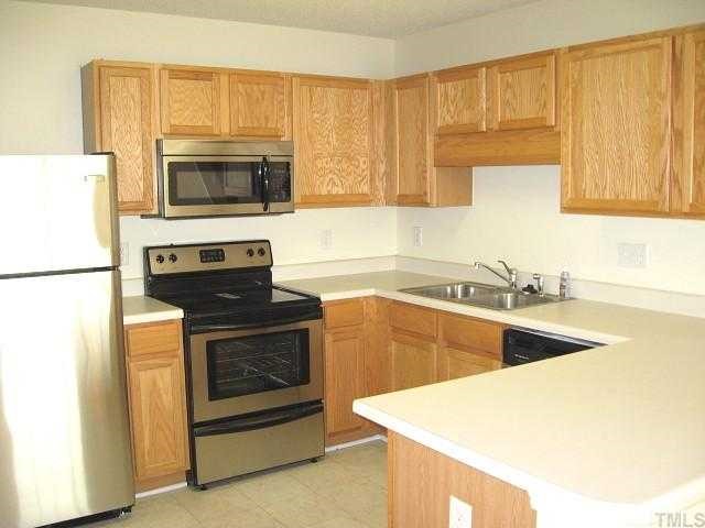 7225 Lowell Ridge Road Raleigh, NC 27616 - Photo 4 of 10 Spacious kitchen with pantry & new stainless steel appliances