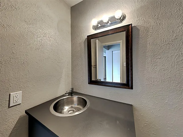a bathroom with a toilet and a sink