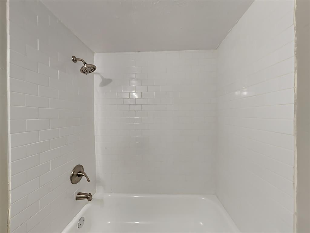 5105 Skillman Street, Unit 120E Dallas, TX 75206 - Photo 15 of 15 a bathroom with a bathtub