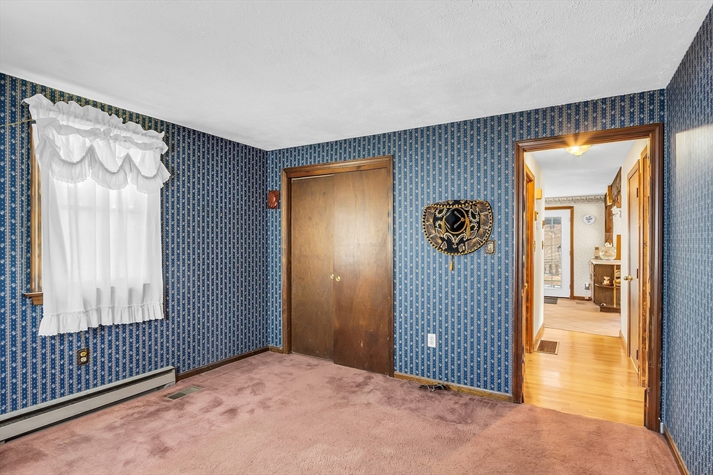 113 Walnut Road Tewksbury, MA 01876 - Photo 16 of 38 a view of a livingroom with an entryway