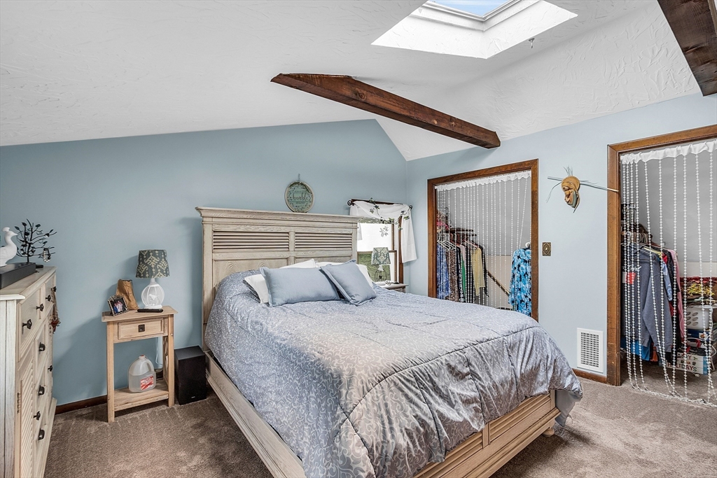 113 Walnut Road Tewksbury, MA 01876 - Photo 18 of 38 a bedroom with a bed and a window