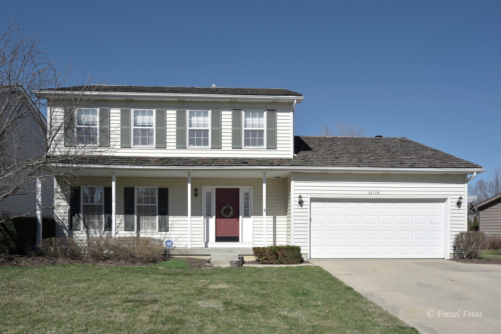 34108 Homestead Road Gurnee, IL 60031 - Photo 1 of 16 a front view of a house with a yard
