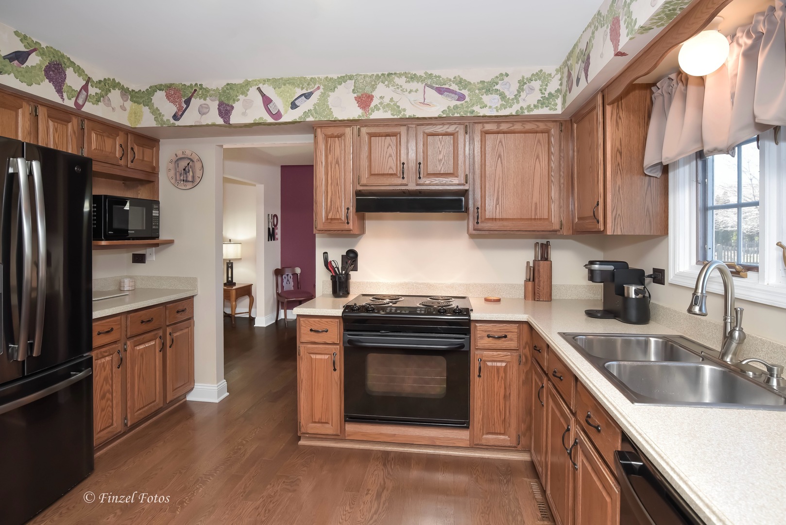 34108 Homestead Road Gurnee, IL 60031 - Photo 3 of 16 a kitchen with stainless steel appliances granite countertop a stove a sink and a refrigerator