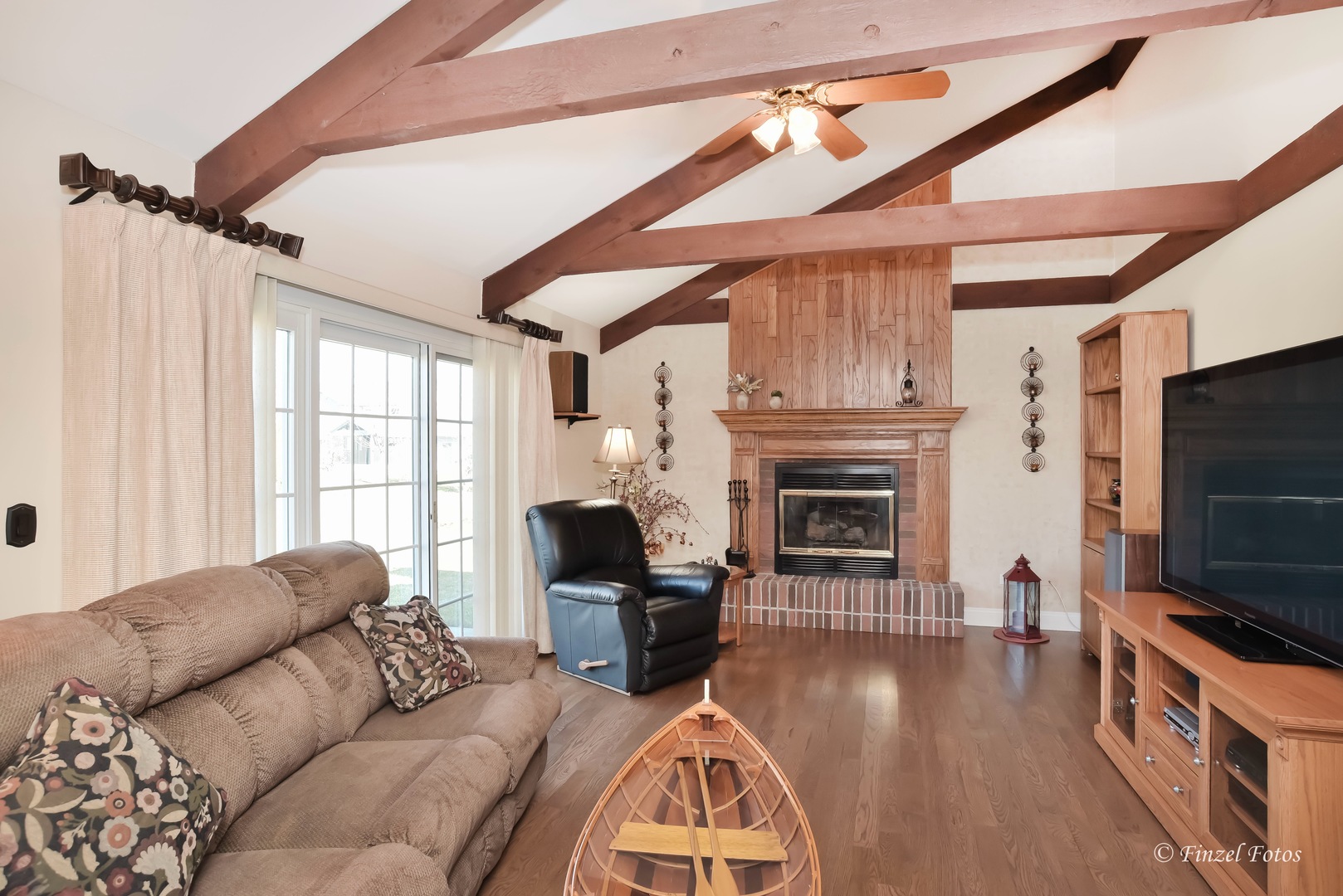 34108 Homestead Road Gurnee, IL 60031 - Photo 5 of 16 a living room with furniture a fireplace and a flat screen tv