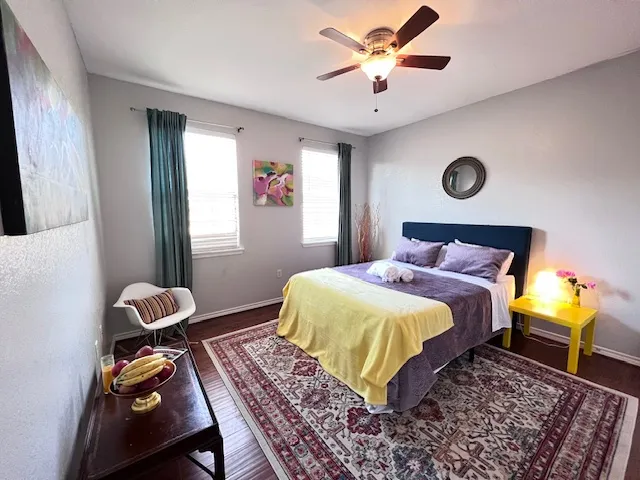 a bedroom with a bed and a window