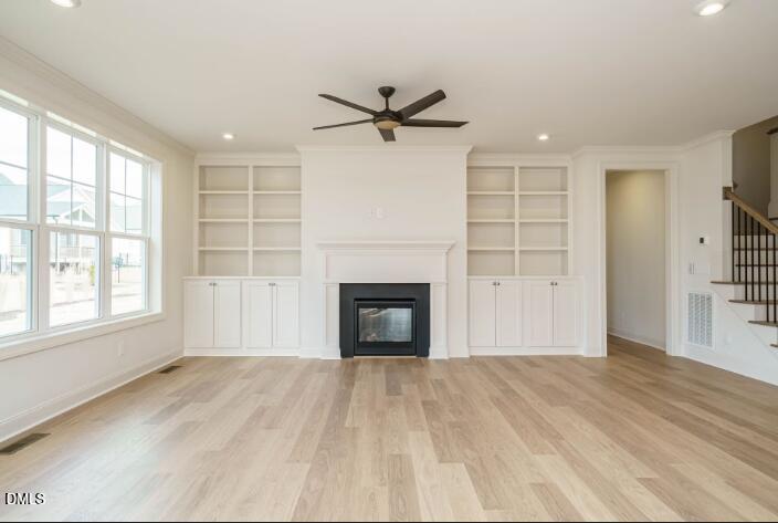 749 West Holly Springs Road Holly Springs, NC 27540 - Photo 14 of 42 wooden floor fireplace and windows in an empty room