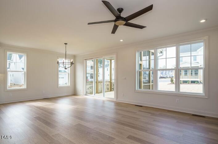 749 West Holly Springs Road Holly Springs, NC 27540 - Photo 16 of 42 a view of an empty room with wooden floor and a window