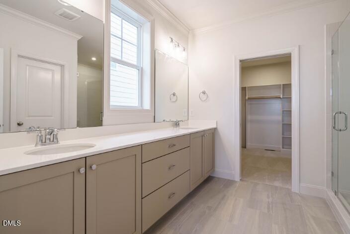 749 West Holly Springs Road Holly Springs, NC 27540 - Photo 23 of 42 a bathroom with a double vanity sink and mirror with shower