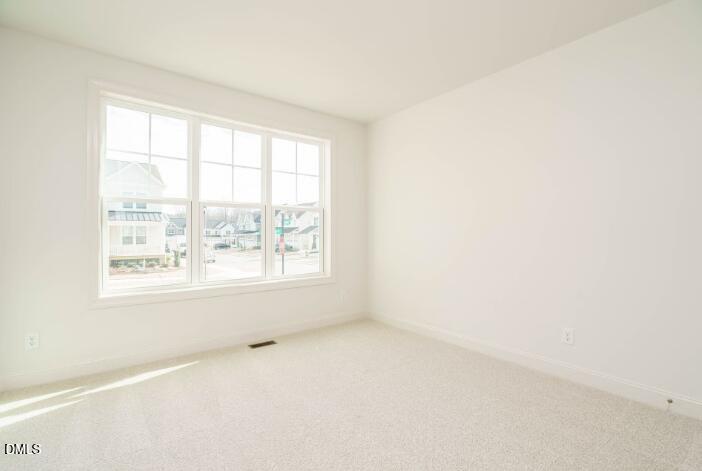 749 West Holly Springs Road Holly Springs, NC 27540 - Photo 31 of 42 an empty room with a window