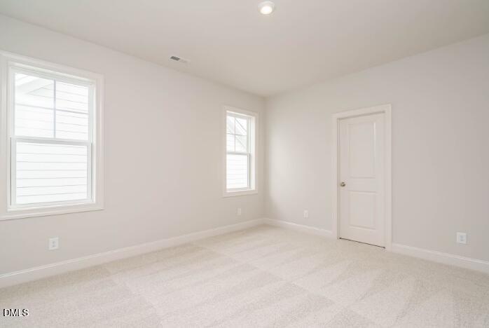 749 West Holly Springs Road Holly Springs, NC 27540 - Photo 35 of 42 an empty room with windows