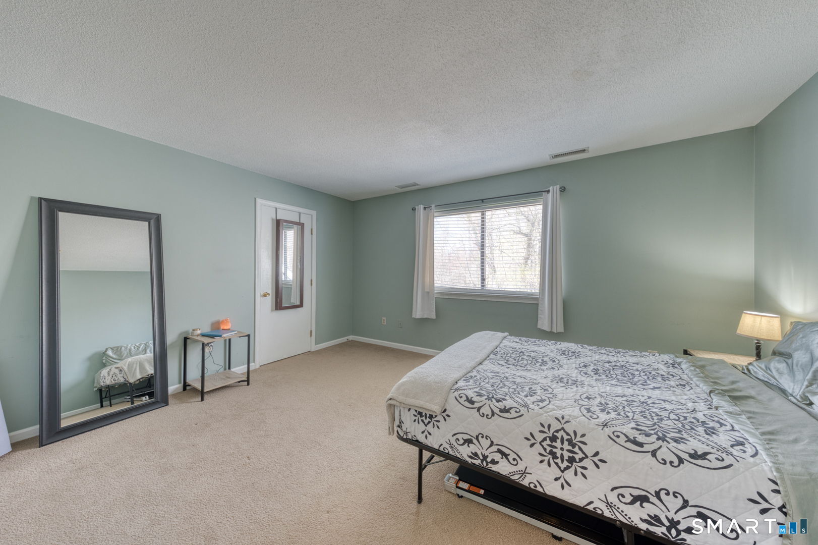 78 Silo Way, Unit 78 Bloomfield, CT 06002 - Photo 18 of 27 a bedroom with a bed and a window