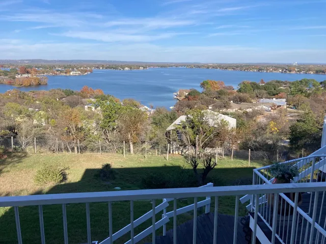 a view of a house with wooden deck