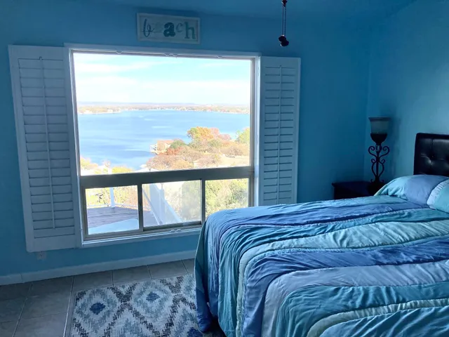 a view of a yard with wooden fence