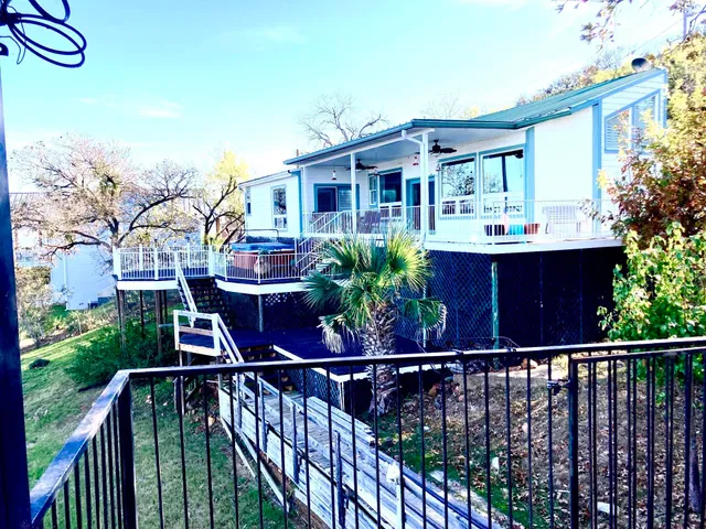 a view of a house with a tree