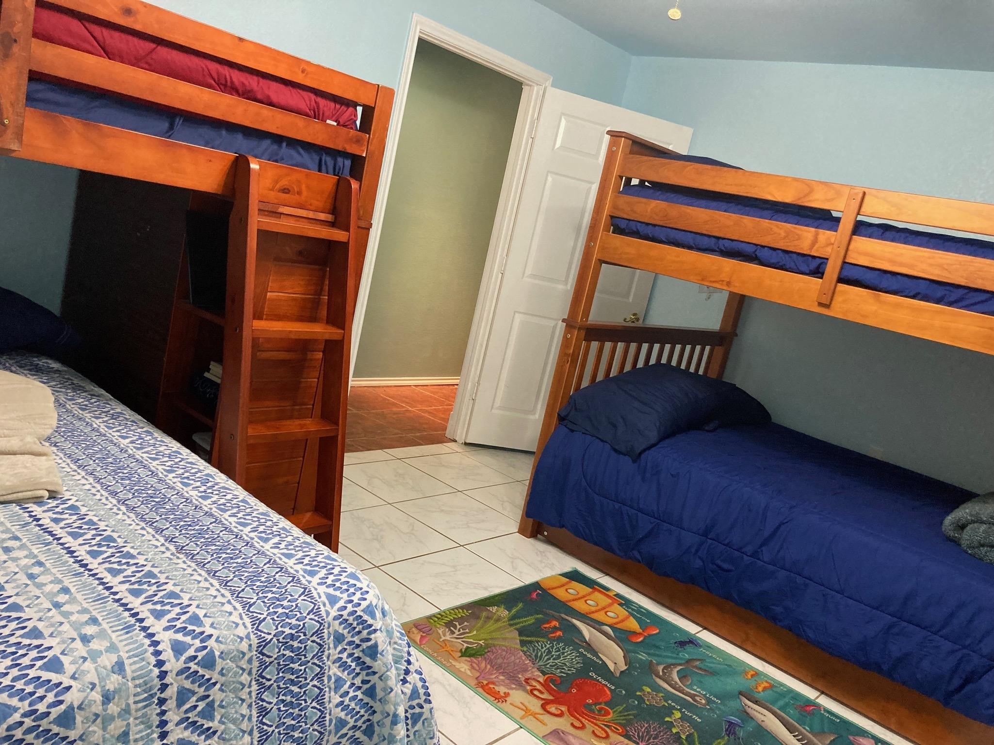 215 Mountain Top Sunrise Beach, TX 78643 - Photo 22 of 29 a bedroom with a bed and a dresser in it