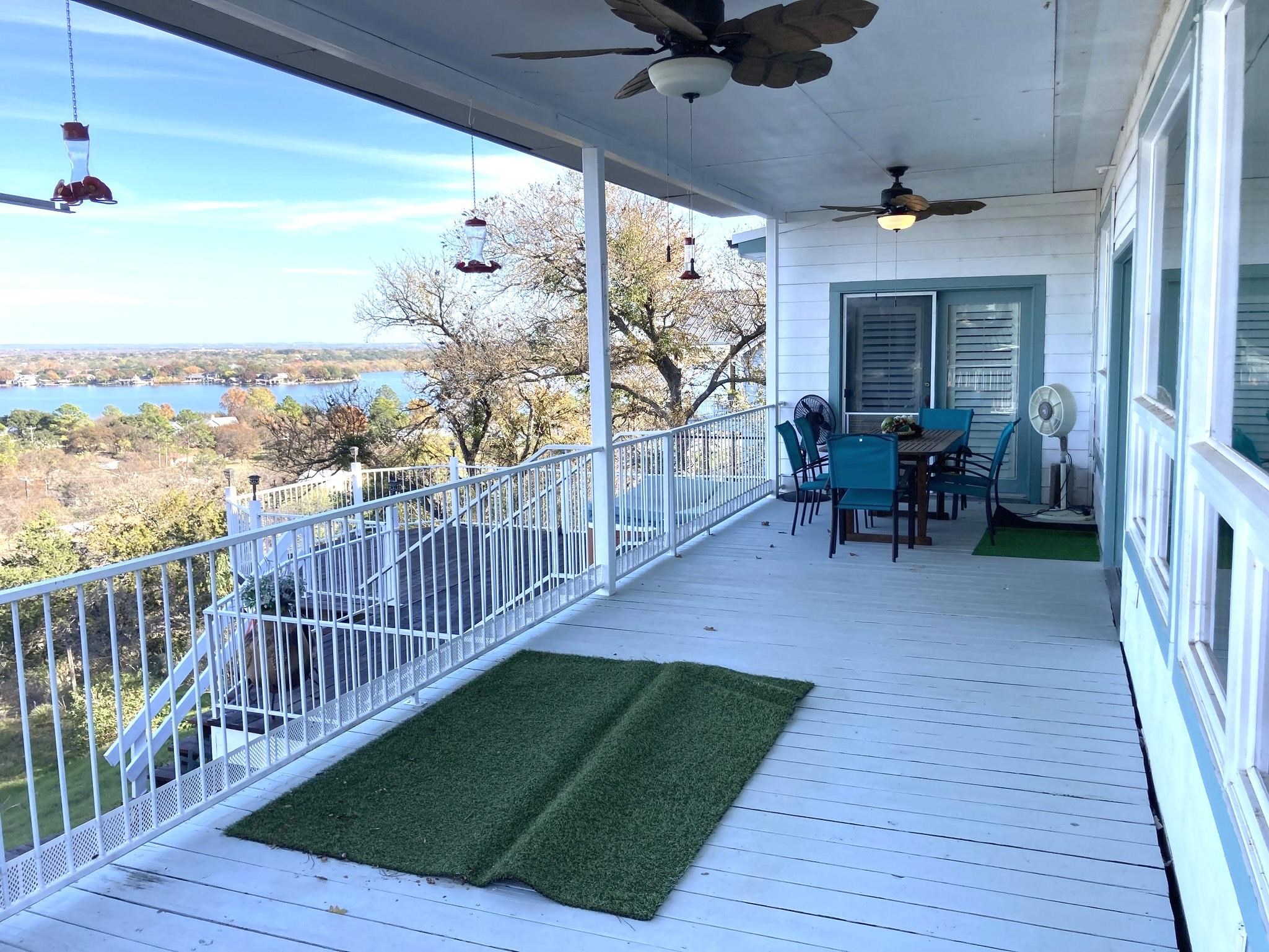 215 Mountain Top Sunrise Beach, TX 78643 - Photo 9 of 29 a view of a chairs and table in patio of the house